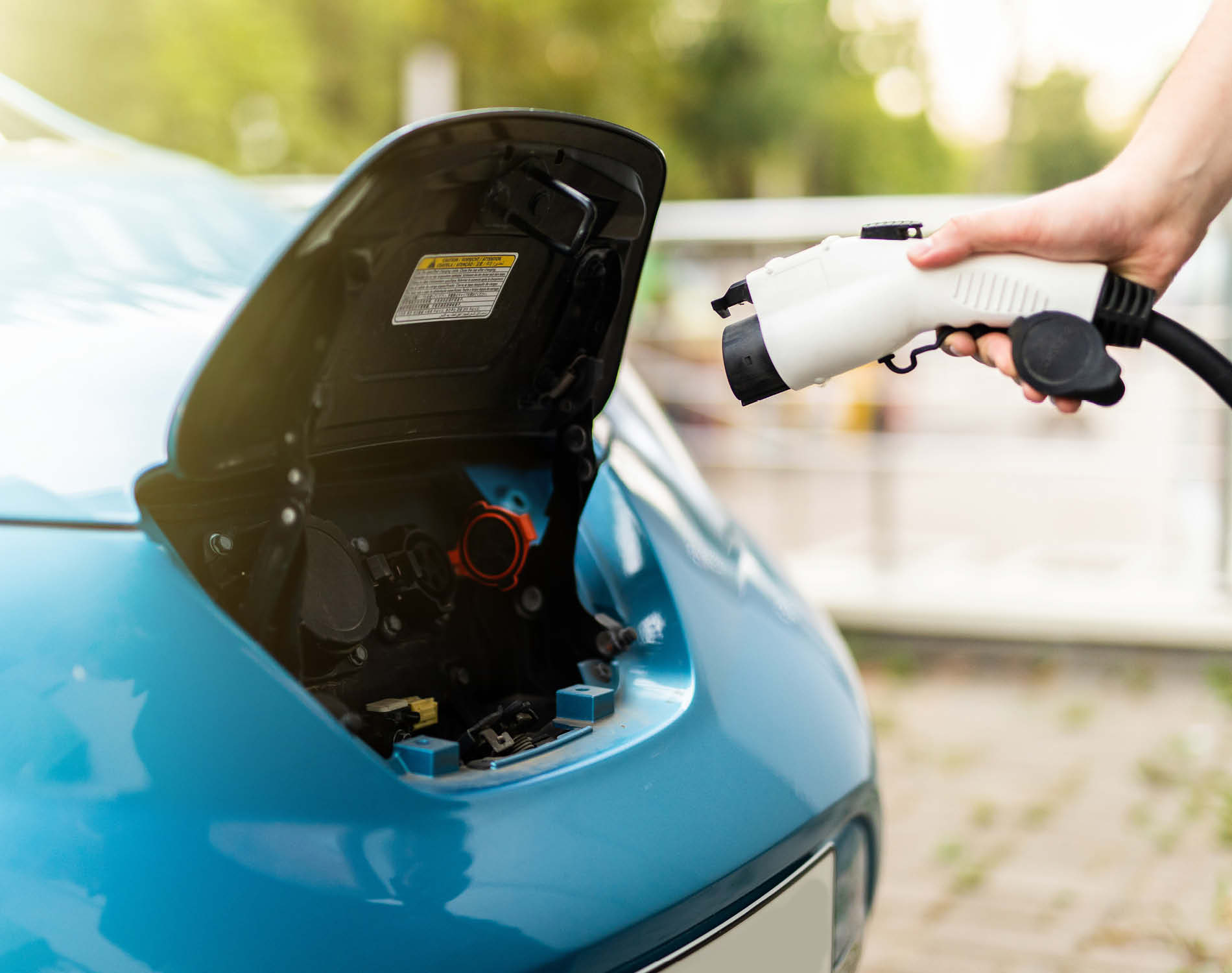 Man charging electric car