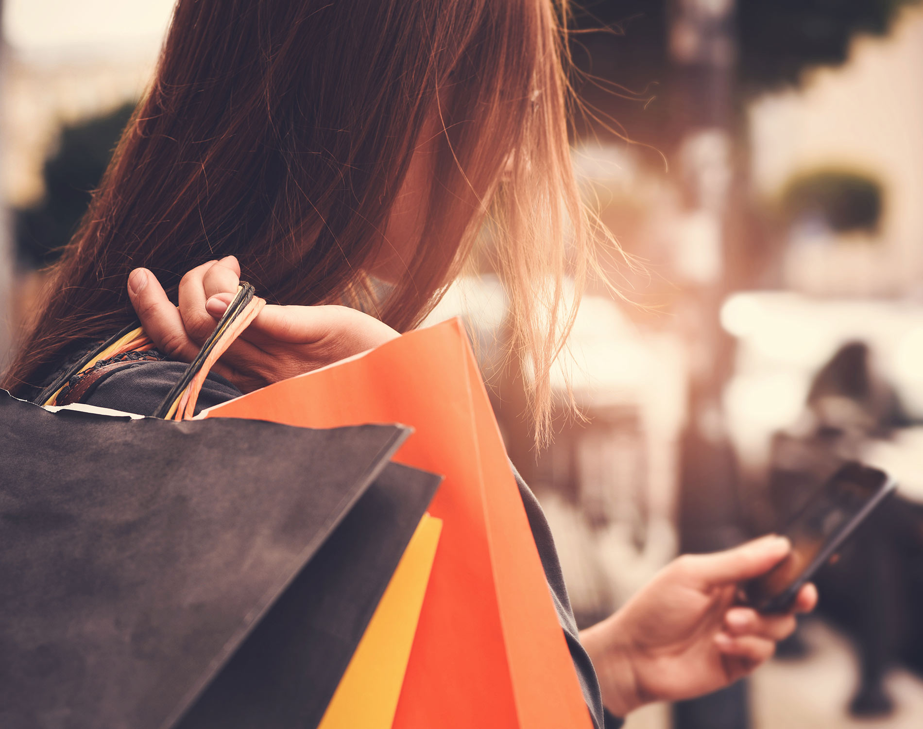 Young woman using a smartphone to shop