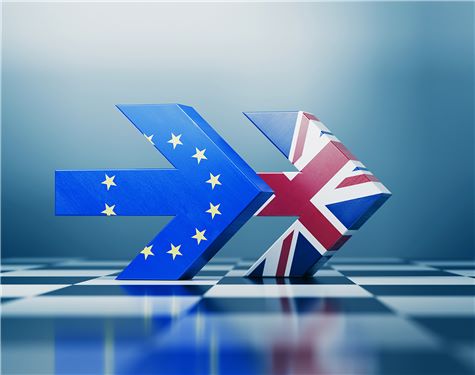 Two arrows textured with British and European Union flags pointing the same direction