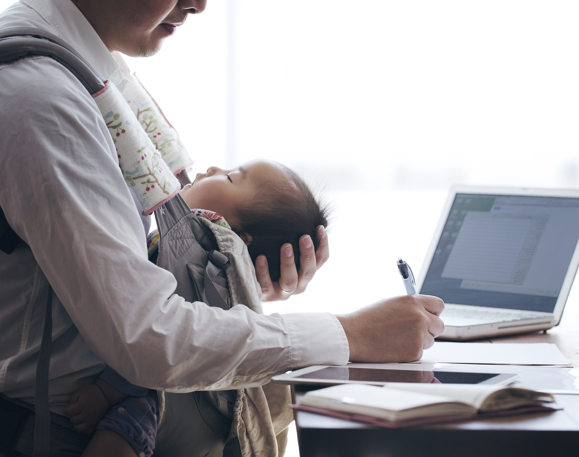Father-with-baby-working-at-home