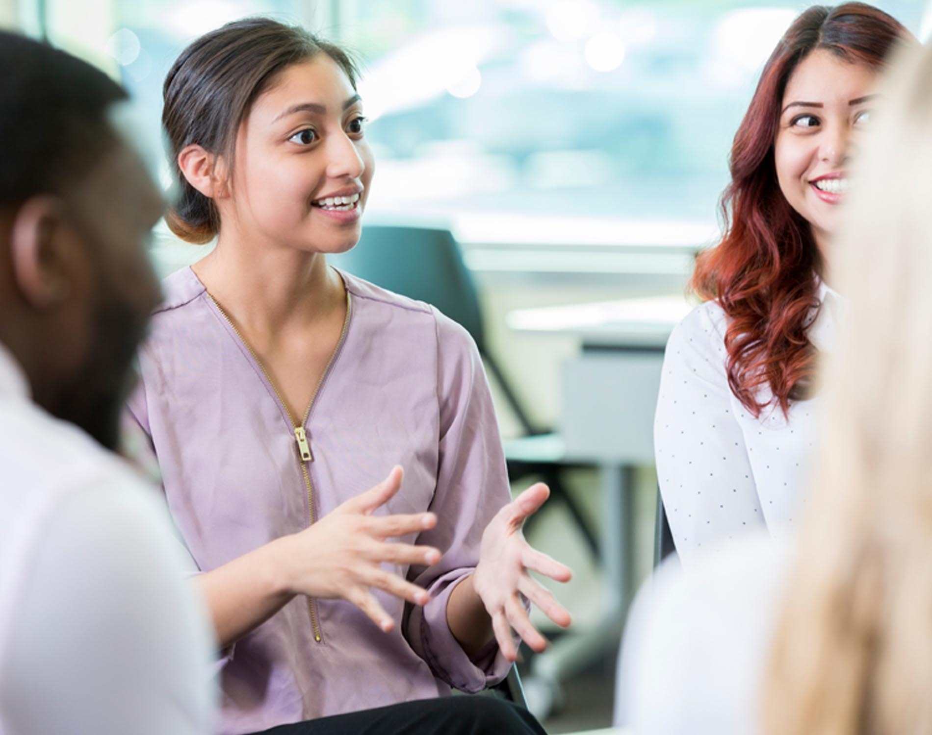 Employees discussing in a circle