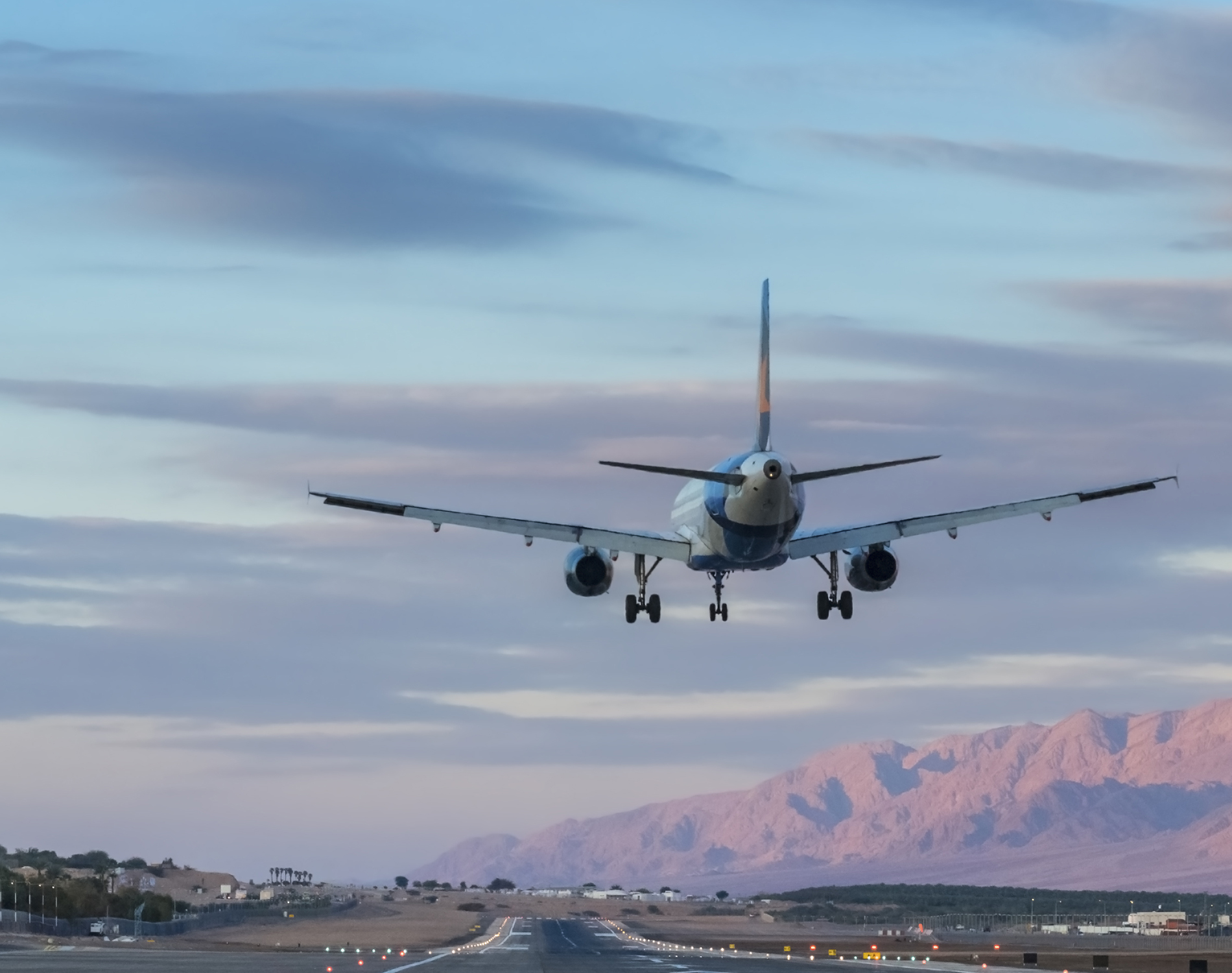 Plane landing, Eilat during sunset, Israel