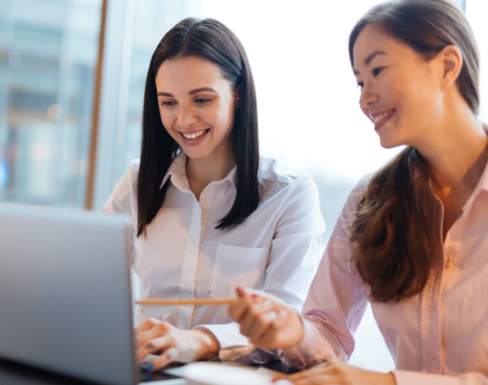 Two young woman at work