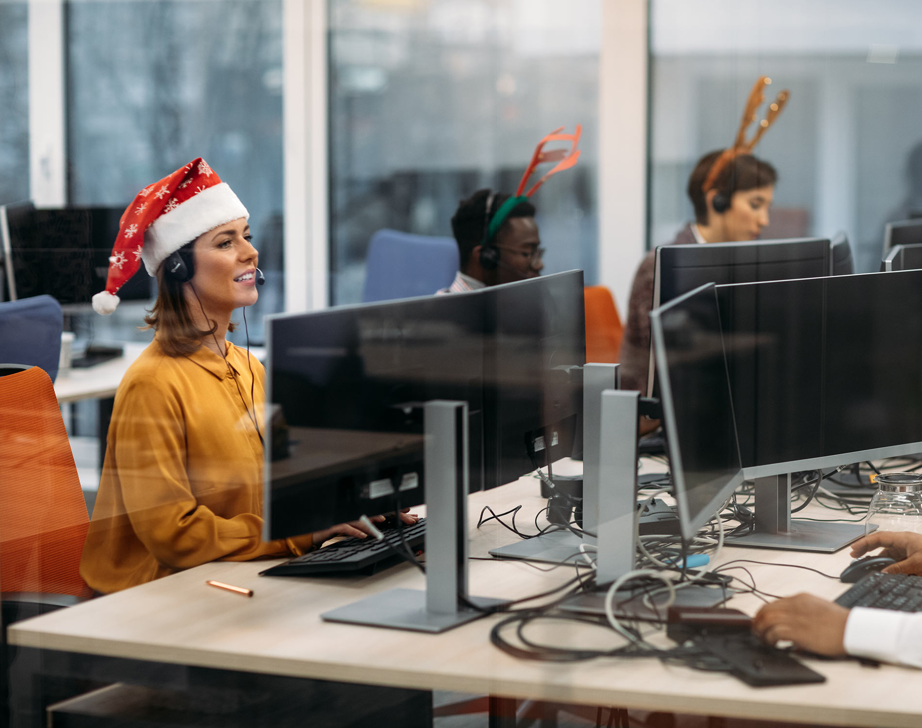 Employees dressed in Christmas clothes