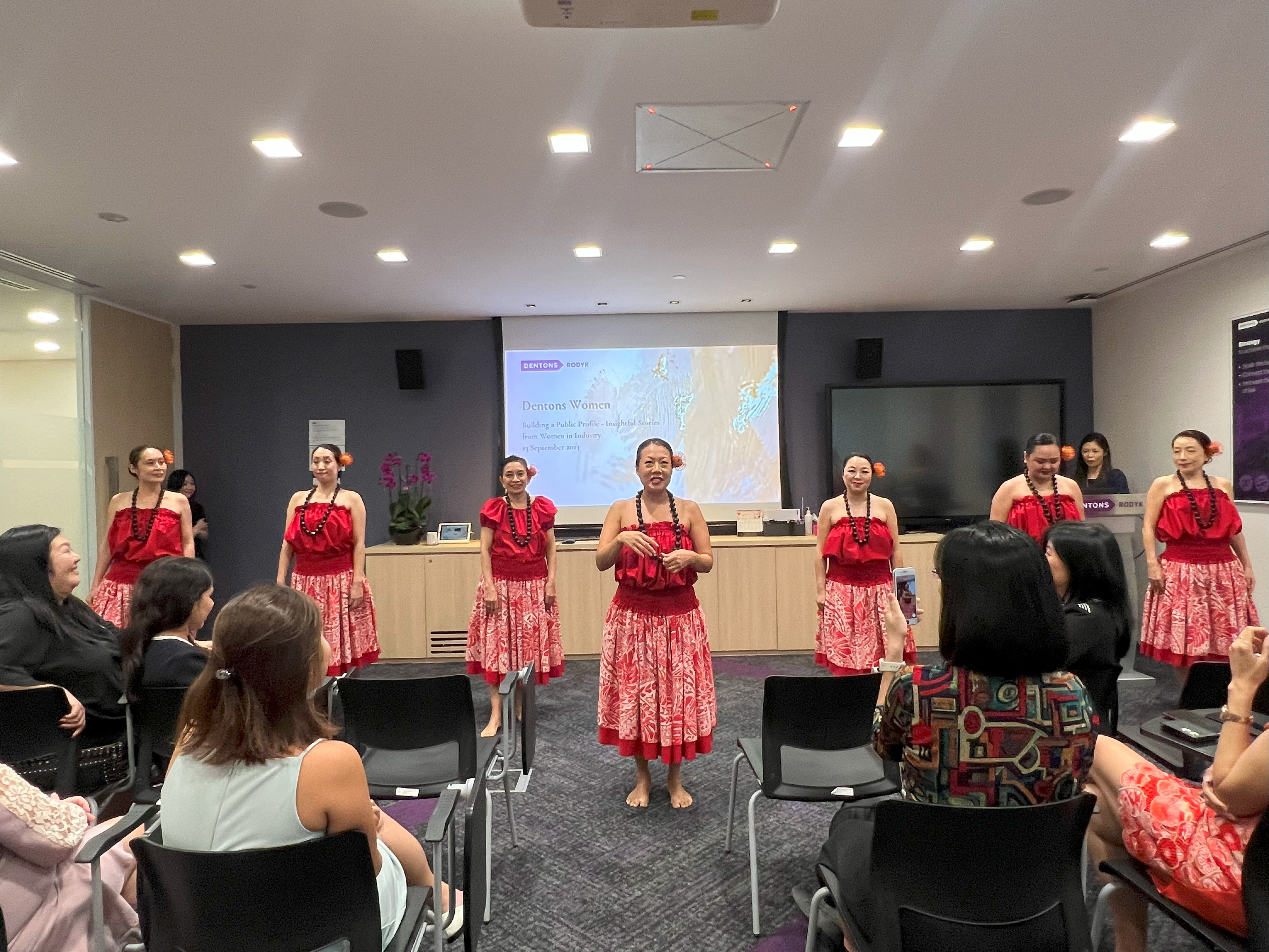 Hula dancers swaying to the groove of Hawaiian music at one of our Dentons Women gathering sessions